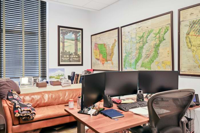 Private office space with cool maps of the United States plastered along the walls
