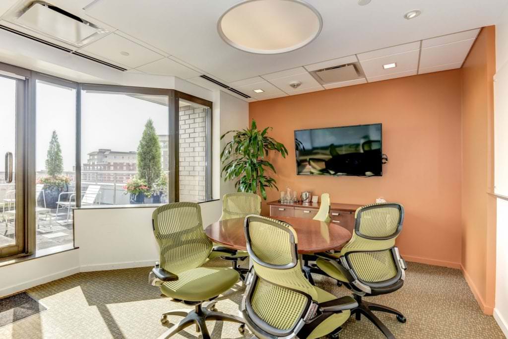 Small conference room with a window overlooking a pretty balcony area