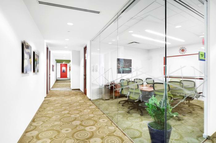 Hallway alongside conference rooms and private offices in Midtown