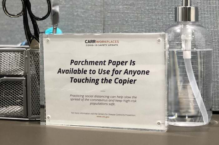 Sign noting parchment paper readily available to Carr Workplaces members