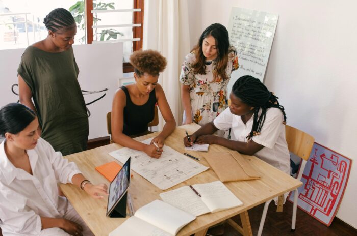 women working together at a desk