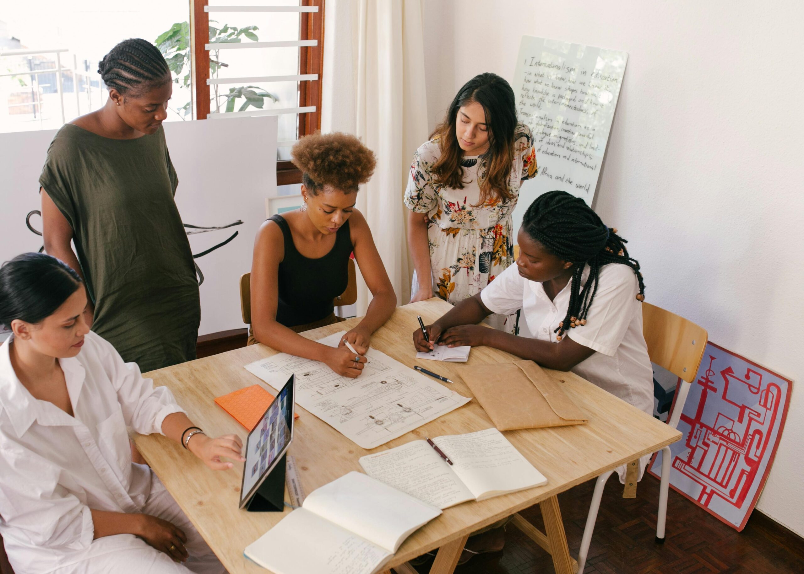 women working together at a desk