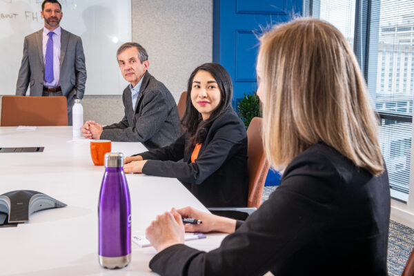 Team meeting in a conference room at Carr Workplaces Friendship Heights