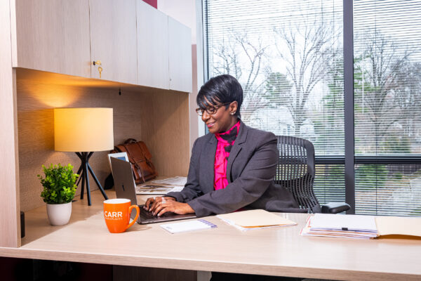 Professional working in a private office at Carr Workplaces Friendship Heights