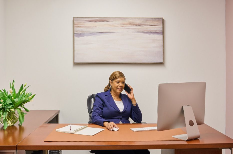Professional on a call in a private Midtown Manhattan office at Carr Workplaces Central Park